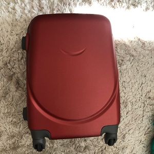 Red carry on suitcase